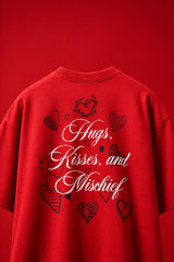 Red oversized tshirt with Hugs Kisses and Mischief white cursive script and hand-drawn hearts back print, boxy fit, men India