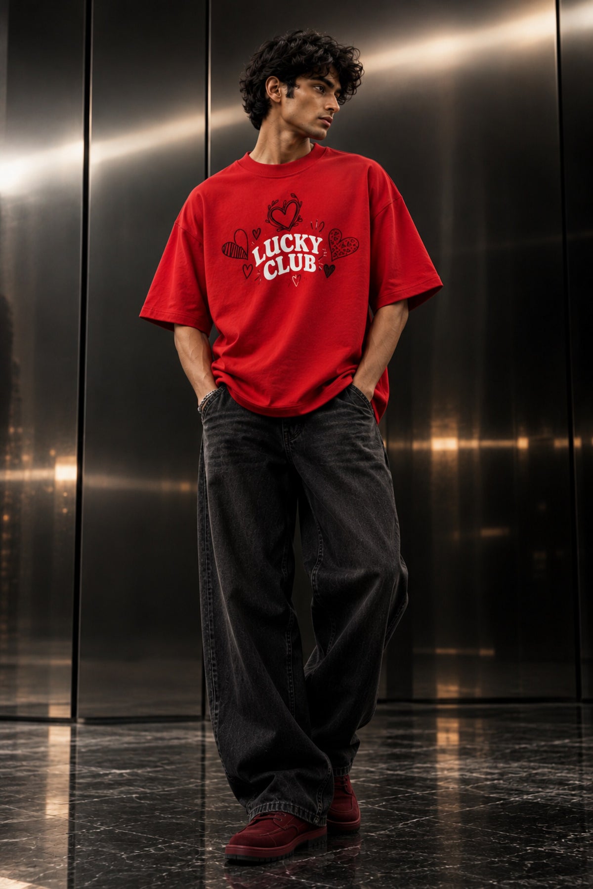 Red oversized tshirt with Hugs Kisses and Mischief white cursive script and hand-drawn hearts back print, boxy fit, men India
