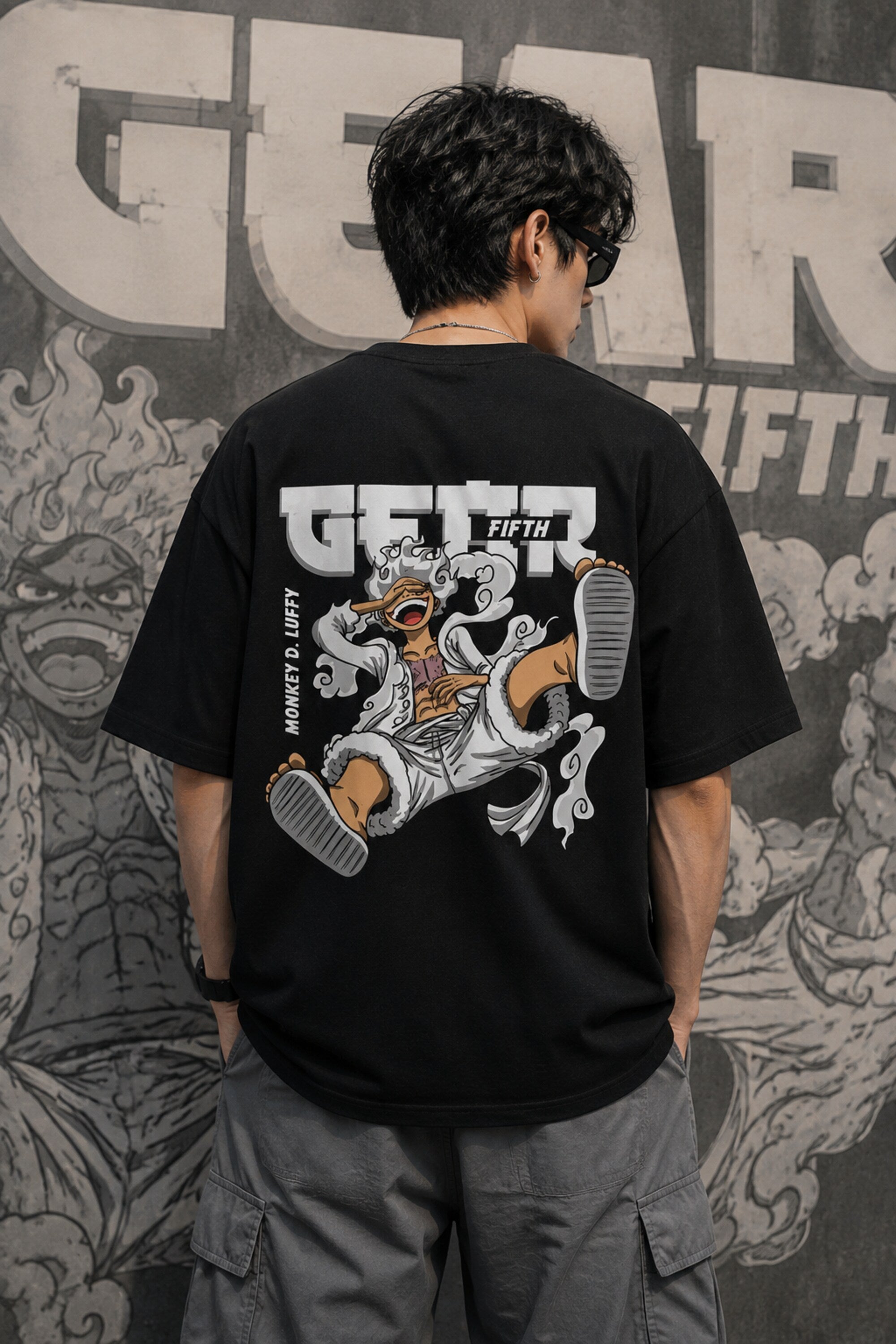 Black oversized t-shirt with Monkey D Luffy Gear 5 face graphic and Japanese text, One Piece anime streetwear India