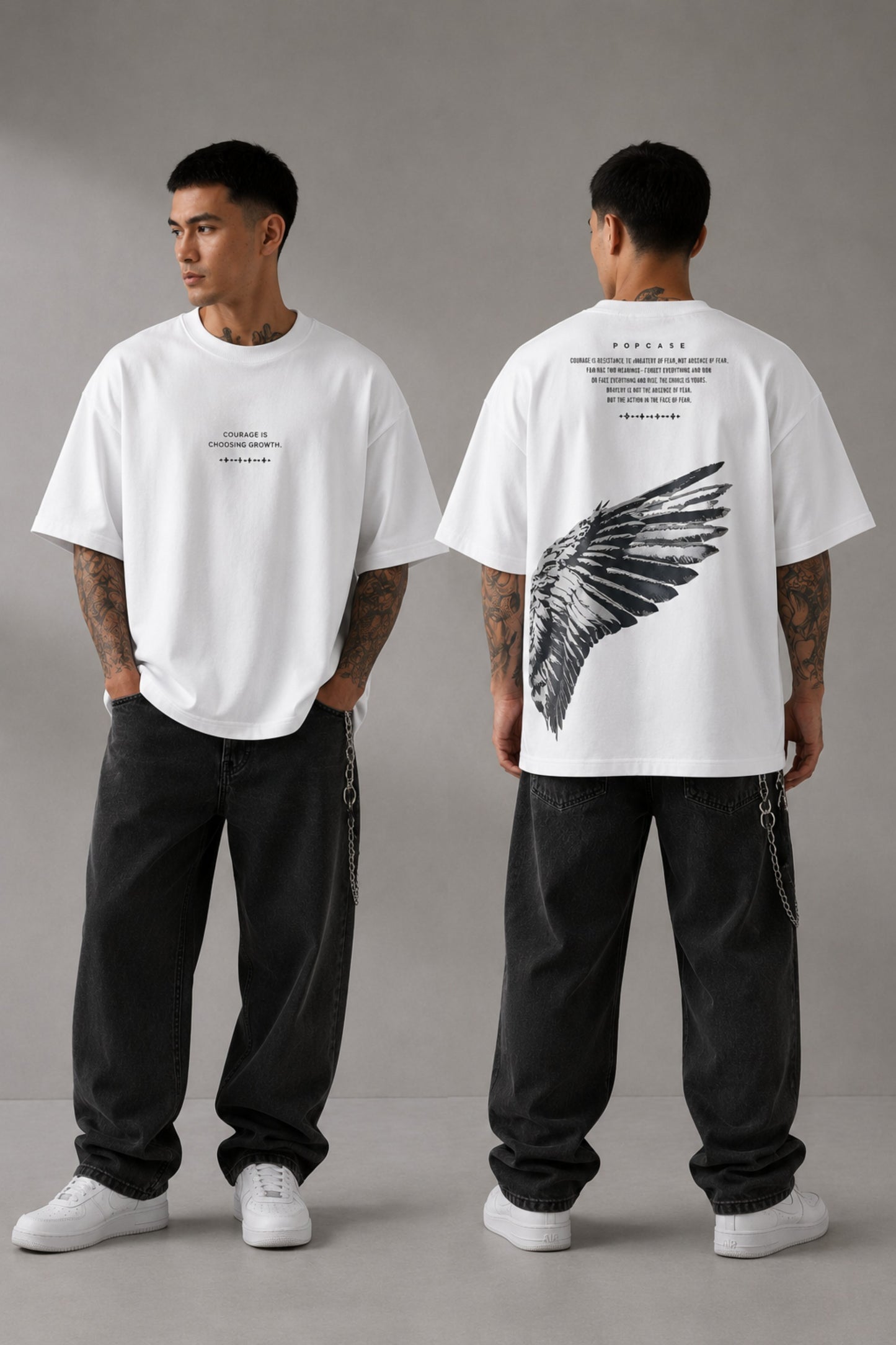 Black POPCASE LAUNCH oversized t-shirt featuring a large, distressed gray wing graphic print. Close-up on the premium fabric and detailed print for a streetwear aesthetic. - white