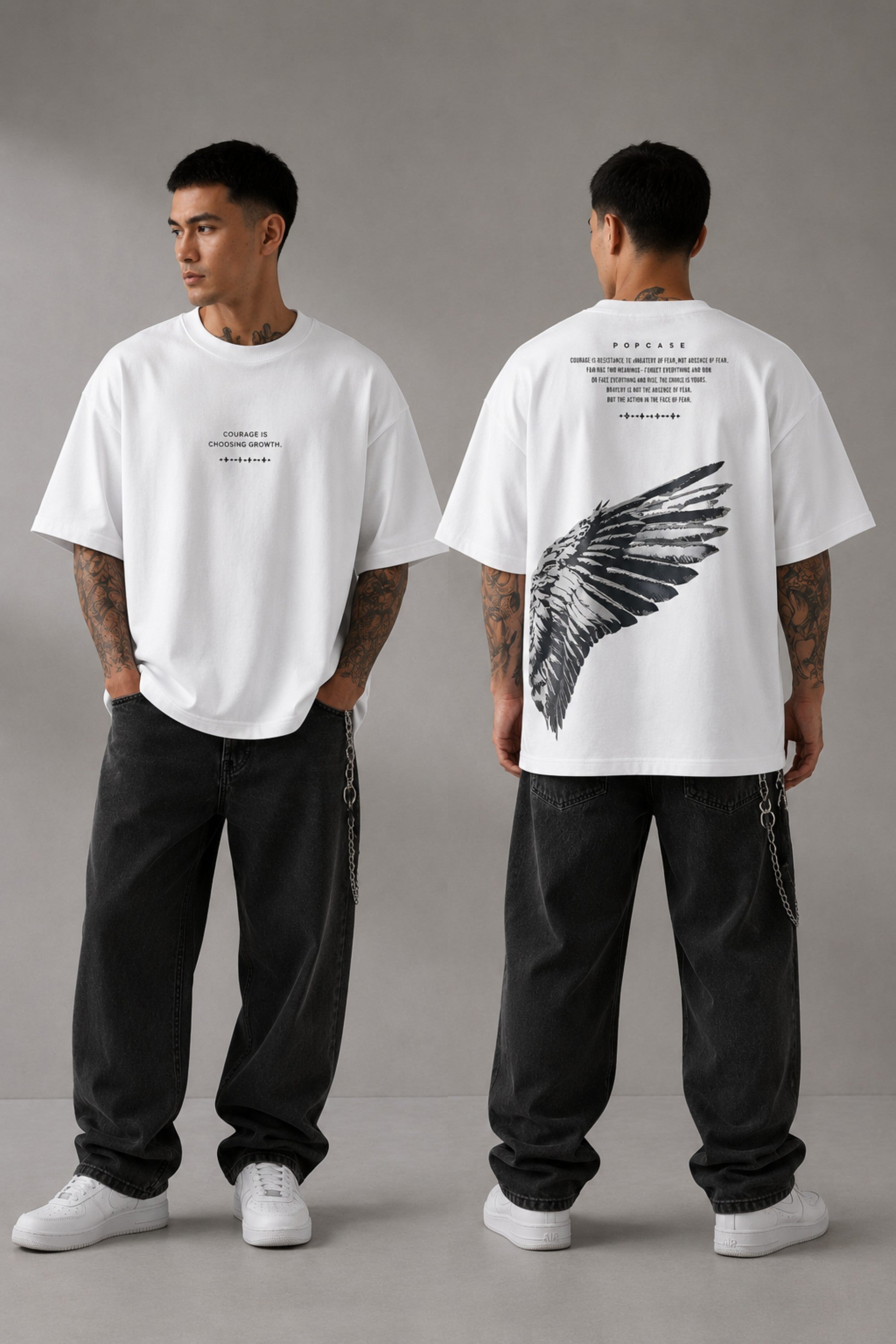 Black POPCASE LAUNCH oversized t-shirt featuring a large, distressed gray wing graphic print. Close-up on the premium fabric and detailed print for a streetwear aesthetic. - white