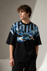 LAYERS black oversized t-shirt with a dynamic blue, white, and orange abstract graphic print, featuring "THE ONLY C" text detail, showcasing its premium fabric and streetwear aesthetic.