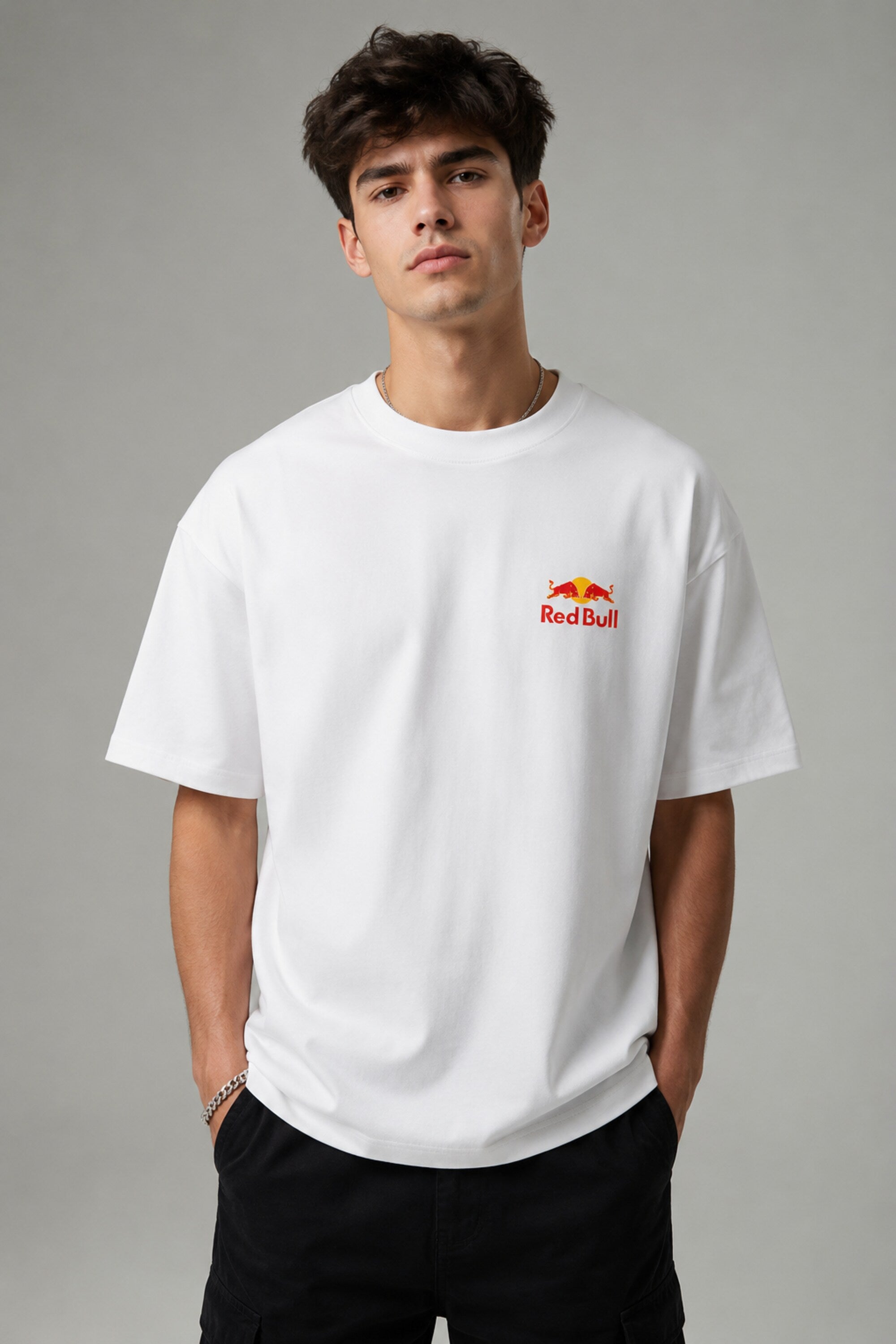 Model wearing white POPCASE Max Verstappen Red Bull oversized t shirt with Red Bull chest logo and large REDBULL race car back graphic