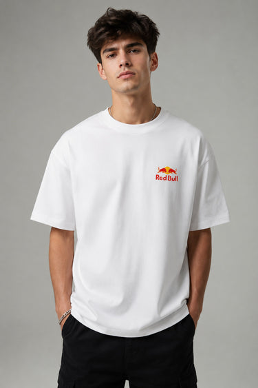 Model wearing white POPCASE Max Verstappen Red Bull oversized t shirt with Red Bull chest logo and large REDBULL race car back graphic