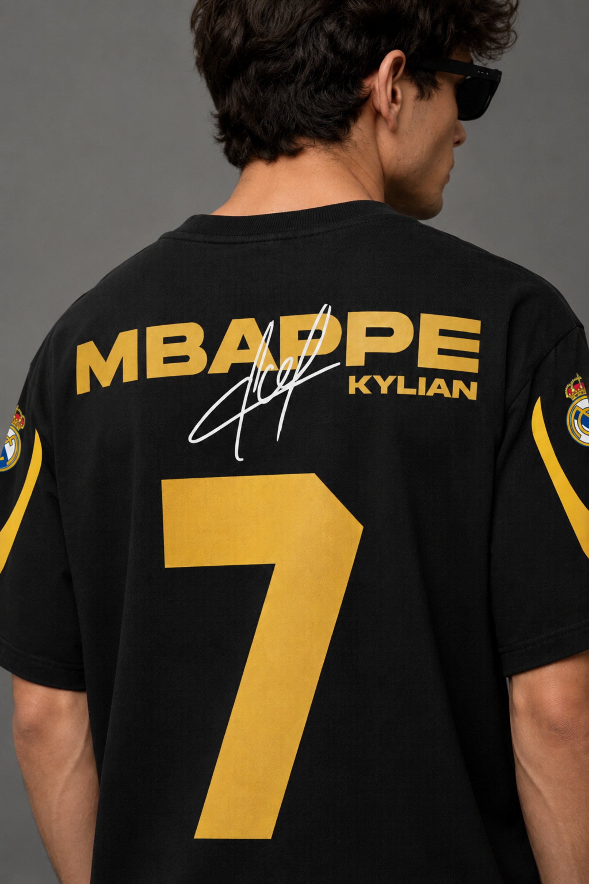 Kylian Mbappe Real Madrid number 7 black oversized t-shirt with gold print and signature