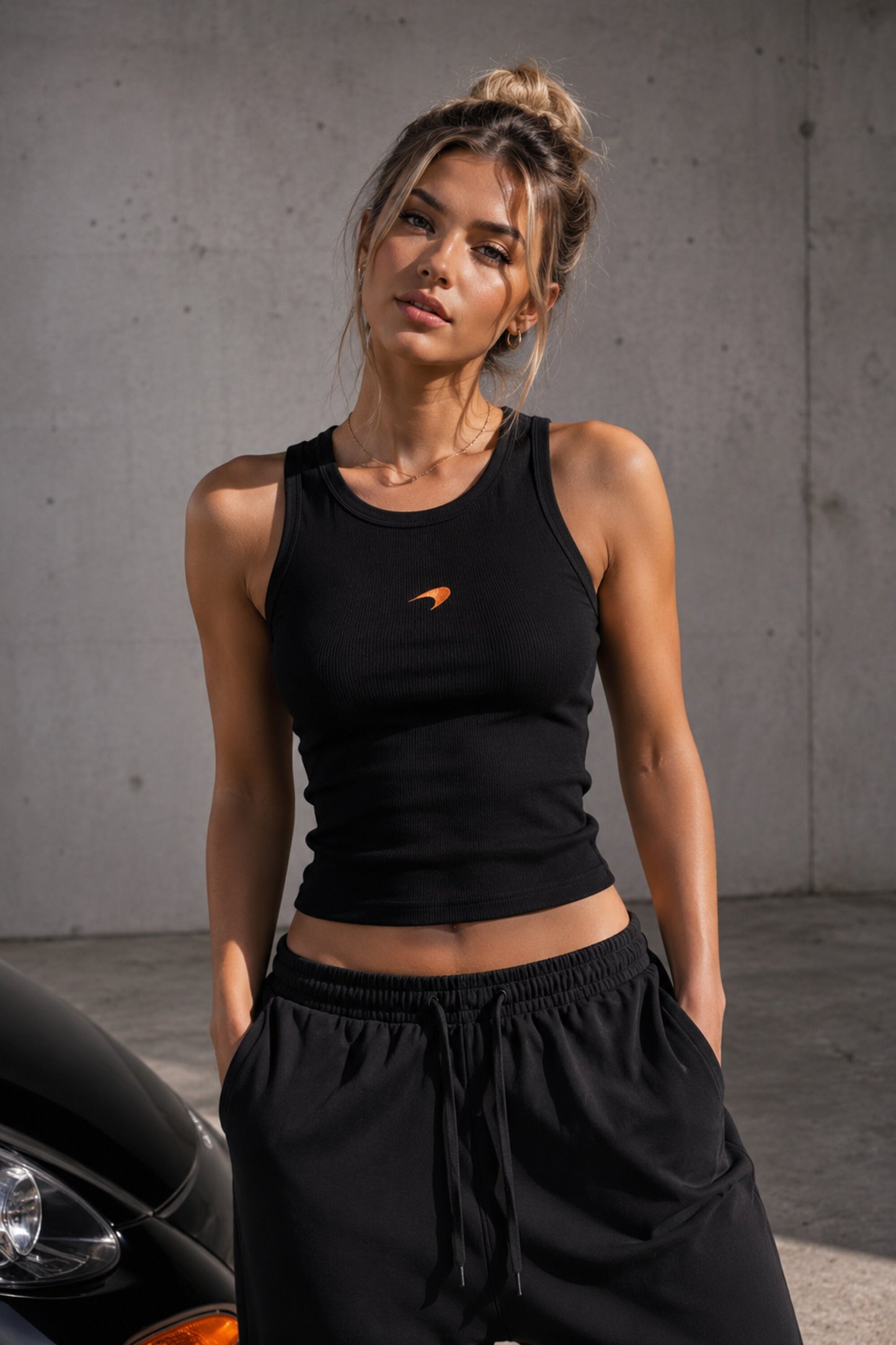 Black ribbed body fit tank top with McLaren Racing orange logo print premium fabric 4-way stretch soft touch motorsport streetwear - black