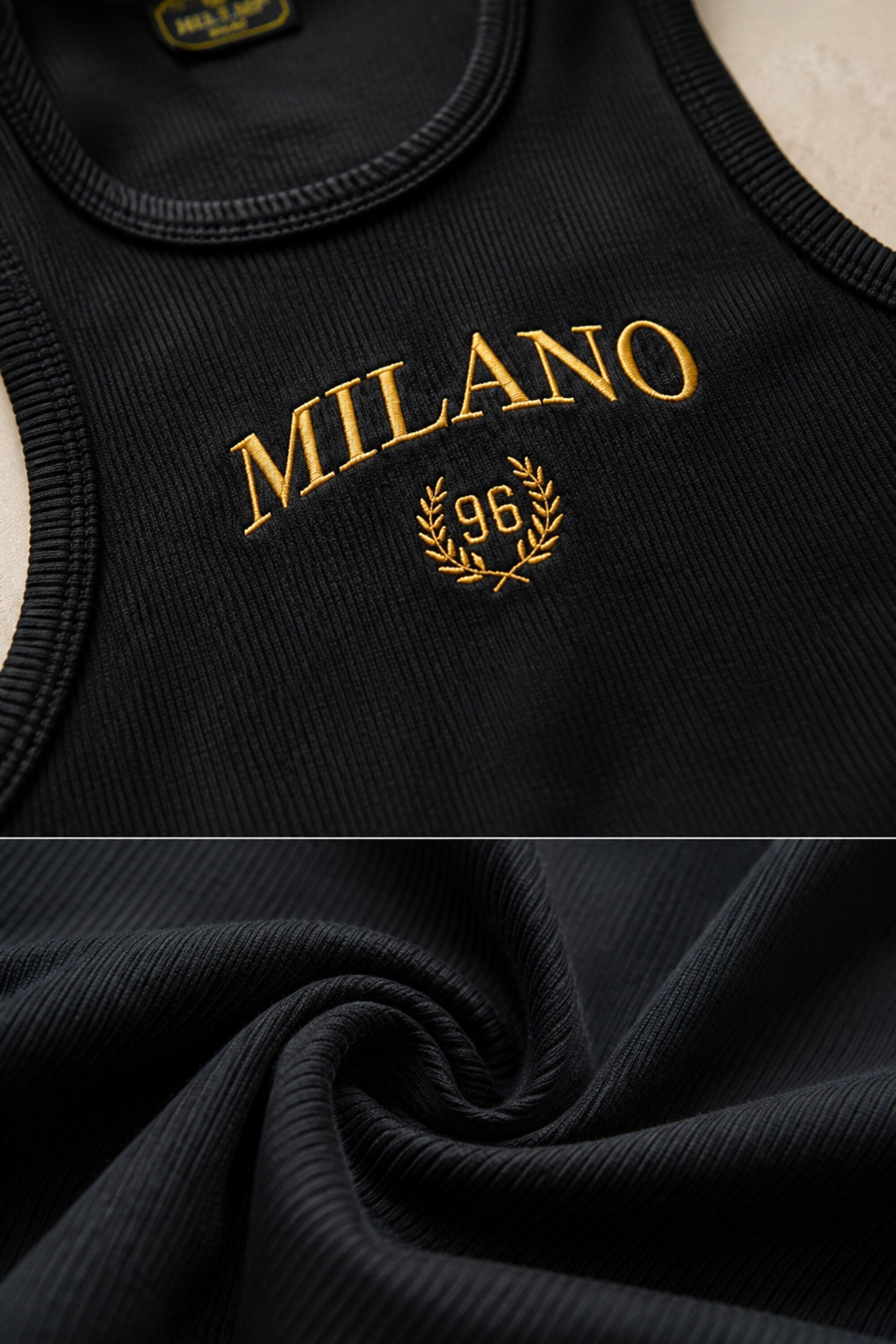 Black ribbed crop tank top with gold Milano 96 embroidery and laurel wreath detail