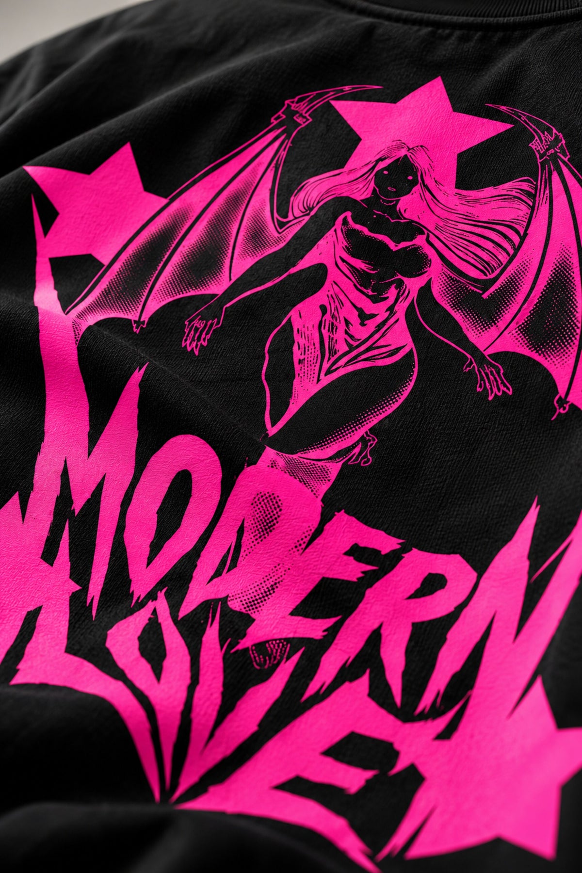 Black oversized tshirt with Modern Love electric pink metal rock font on chest and pink star on sleeve, drop shoulder boxy fit, men India
