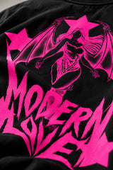 Black oversized tshirt with Modern Love electric pink metal rock font on chest and pink star on sleeve, drop shoulder boxy fit, men India