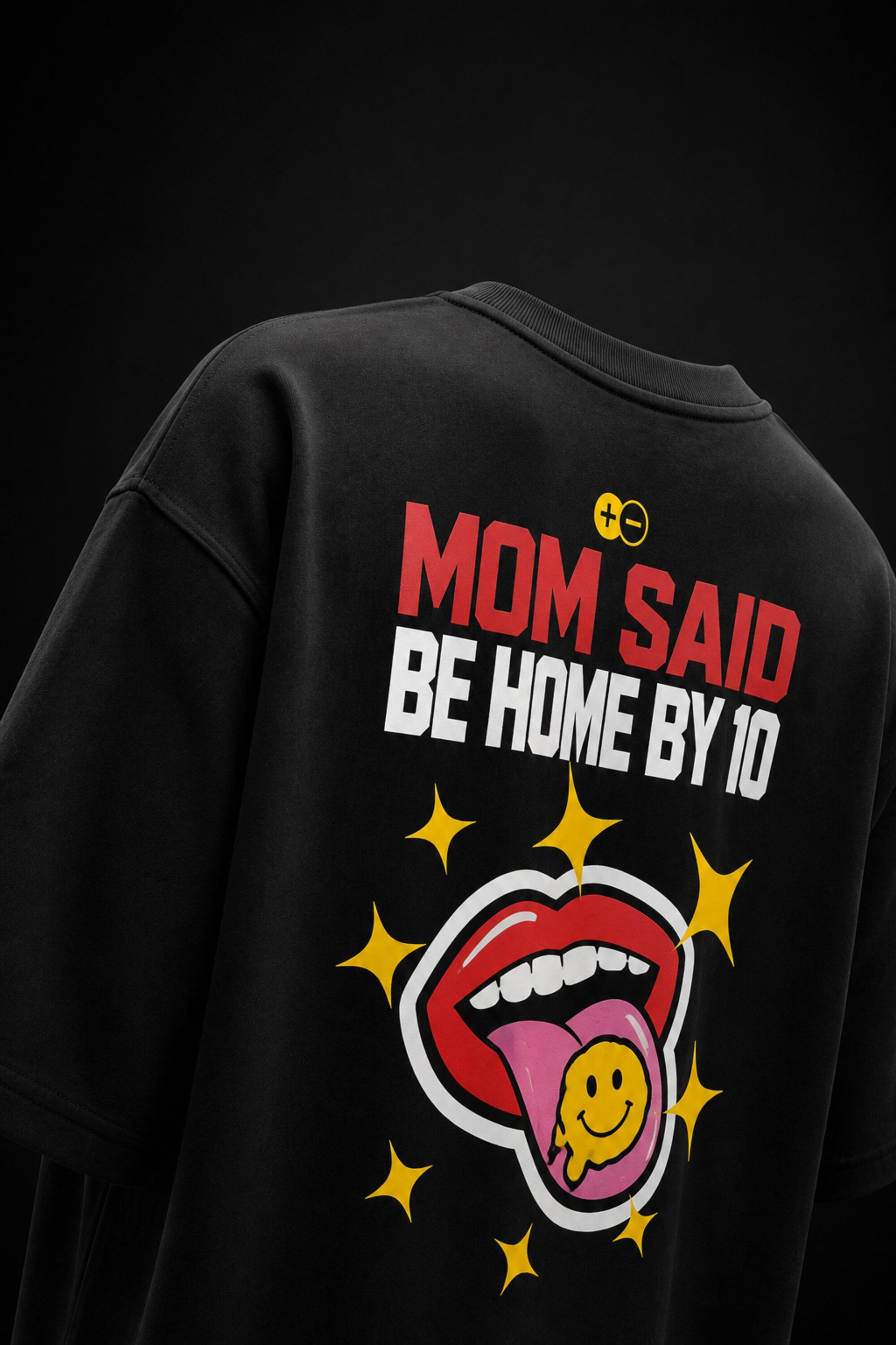 Rebellion black oversized t-shirt with bold white text and gold sparkle star graphic