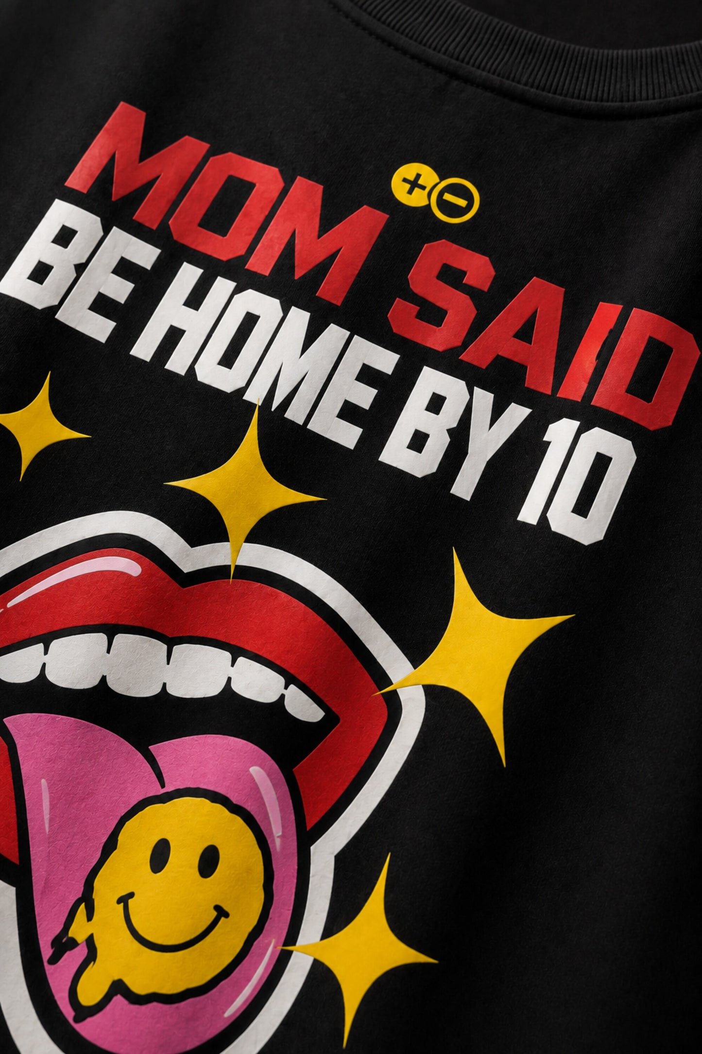 Rebellion black oversized t-shirt with bold white text and gold sparkle star graphic
