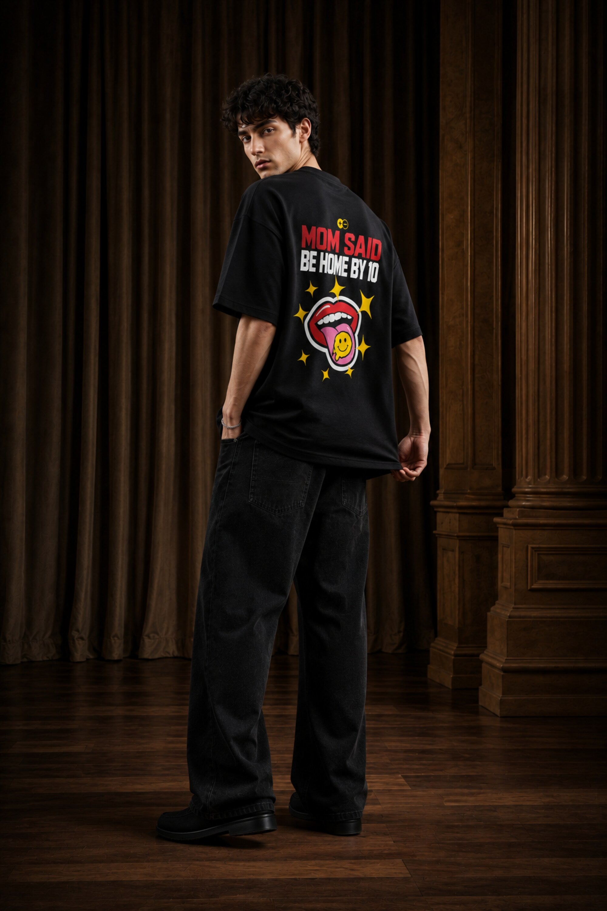 Rebellion black oversized t-shirt with bold white text and gold sparkle star graphic