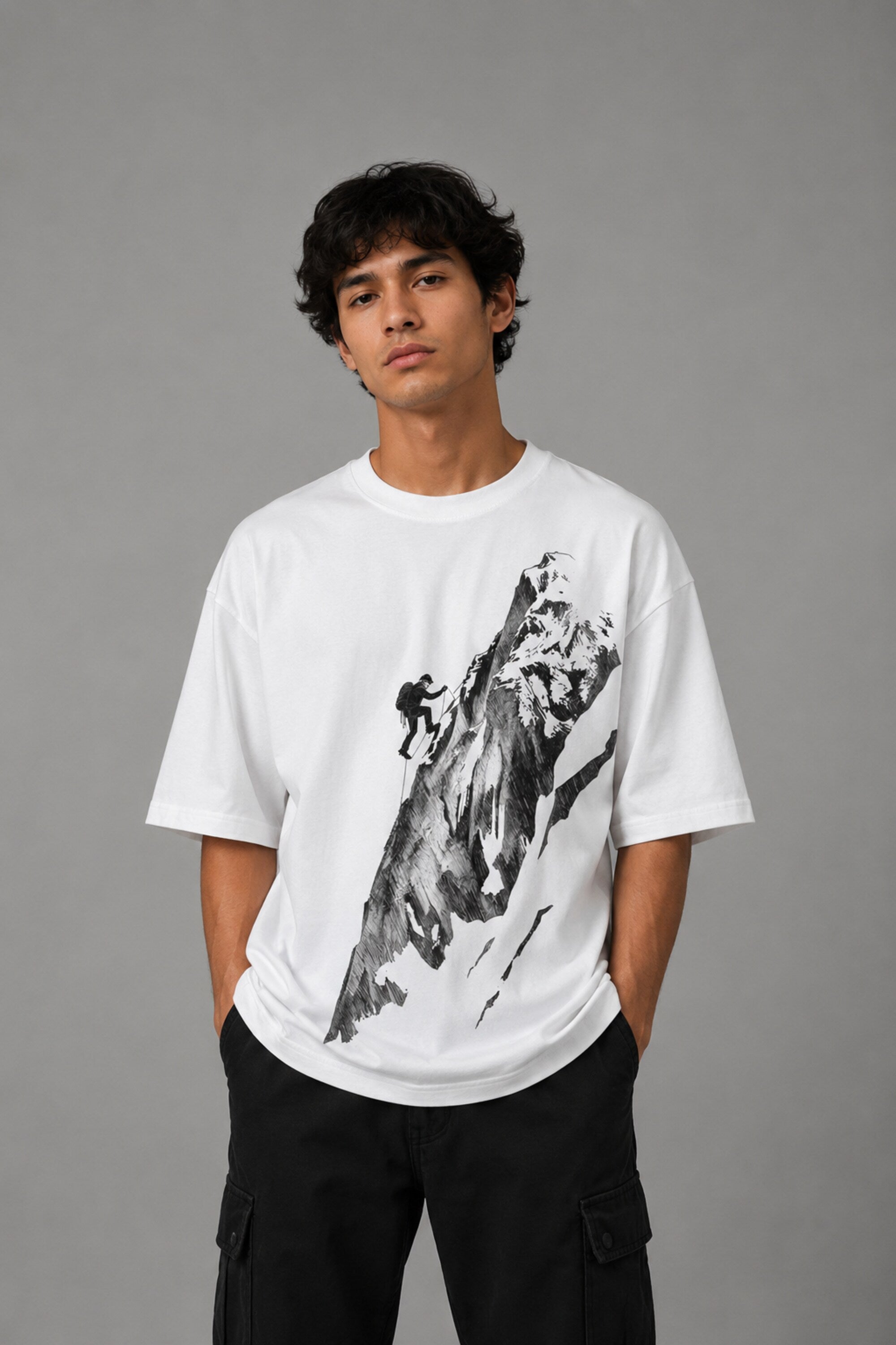 POP-MOUNTAIN-CLIMBER oversized t-shirt in white, featuring a striking black and white graphic of a mountain climber. Designed for ultimate comfort and streetwear style.