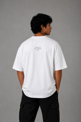 POP-MOUNTAIN-CLIMBER oversized t-shirt in white, featuring a striking black and white graphic of a mountain climber. Designed for ultimate comfort and streetwear style.