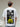 Person wearing a white t-shirt with a graphic on the back, sitting on a chair.