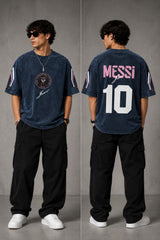 Man wearing an anthracite black Messi oversized t-shirt with a circular team logo and signature, showcasing the relaxed fit and premium fabric. - midnight indigo