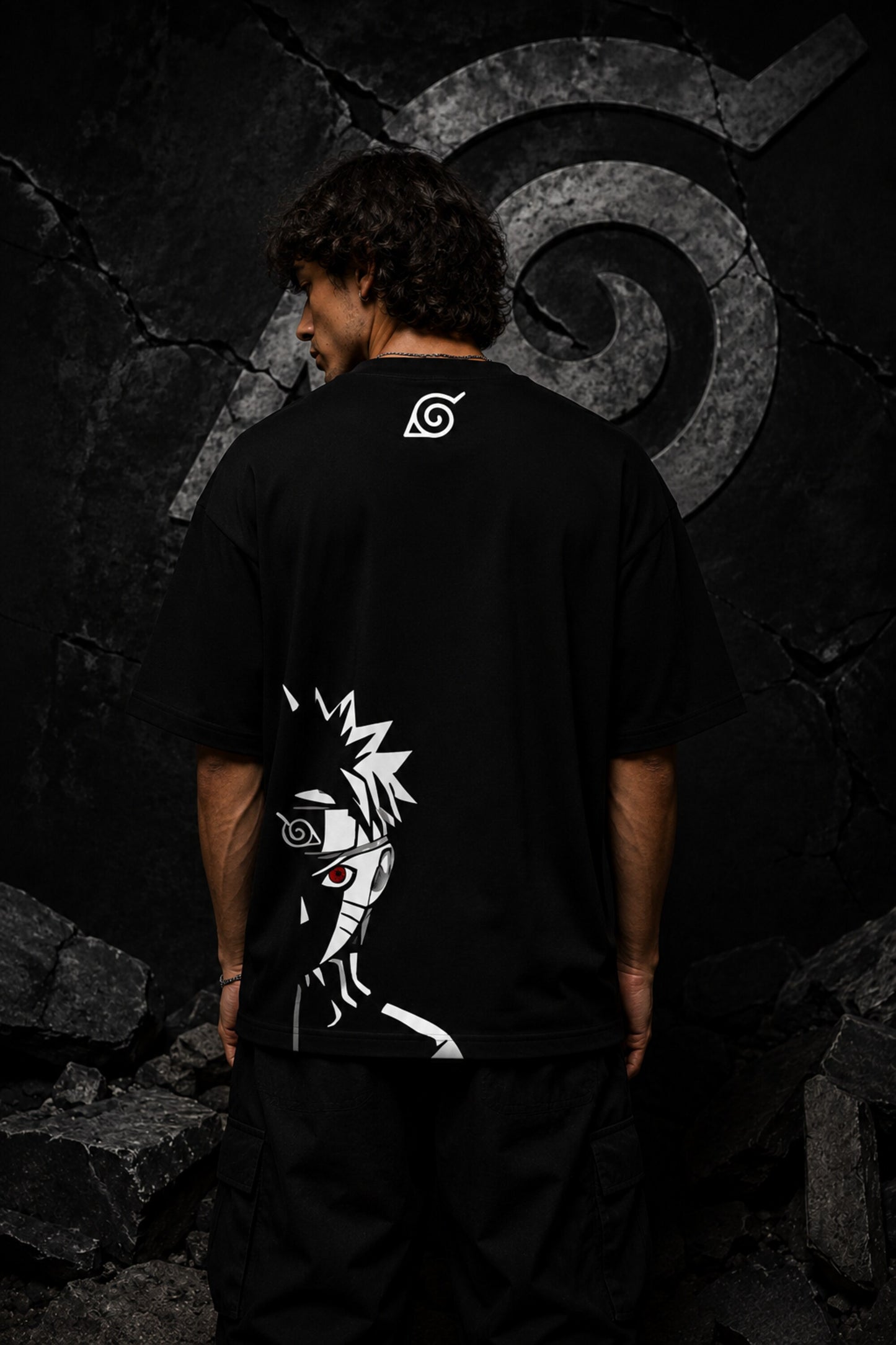 Black oversized t-shirt with Naruto logo in white brushstroke lettering and Japanese text, anime streetwear India
