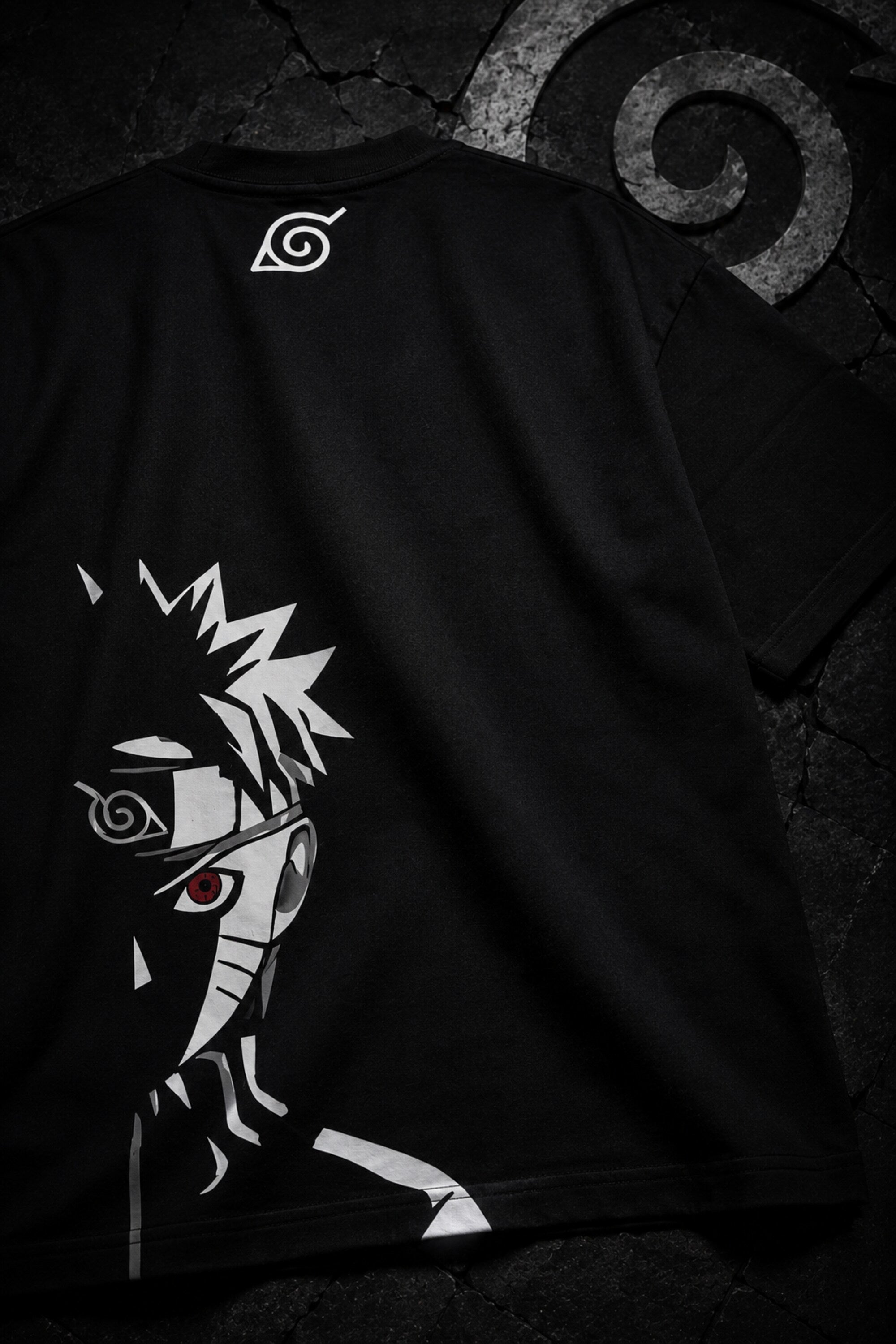 Black oversized t-shirt with Naruto logo in white brushstroke lettering and Japanese text, anime streetwear India