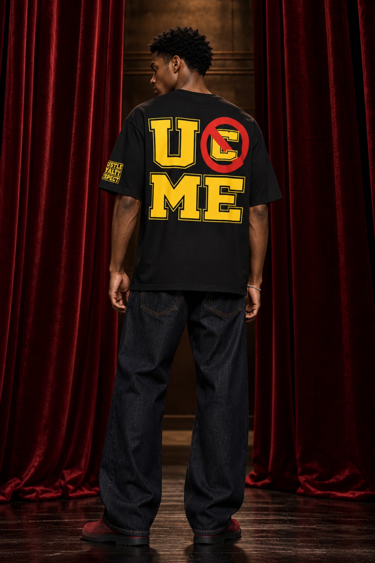 Black tshirt with Never Give Up yellow varsity block letters and John Cena graphic on front, drop shoulder boxy fit, men India