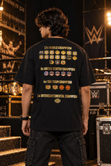 Black oversized tshirt with The Grand Slam Champ Is Here gold text and down arrow on front, drop shoulder boxy fit, men India