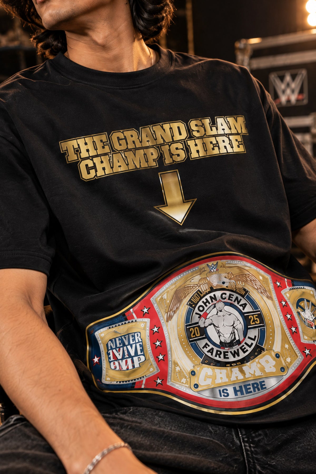 Black oversized tshirt with The Grand Slam Champ Is Here gold text and down arrow on front, drop shoulder boxy fit, men India