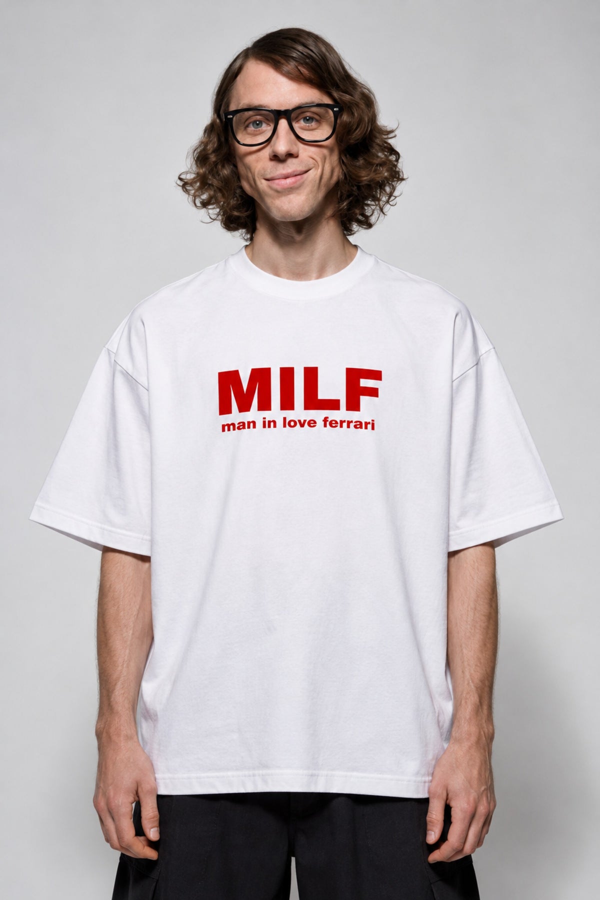 White oversized tshirt with Need Money for Ferrari bold drip graffiti text on back in black and red, drop shoulder boxy fit, men India