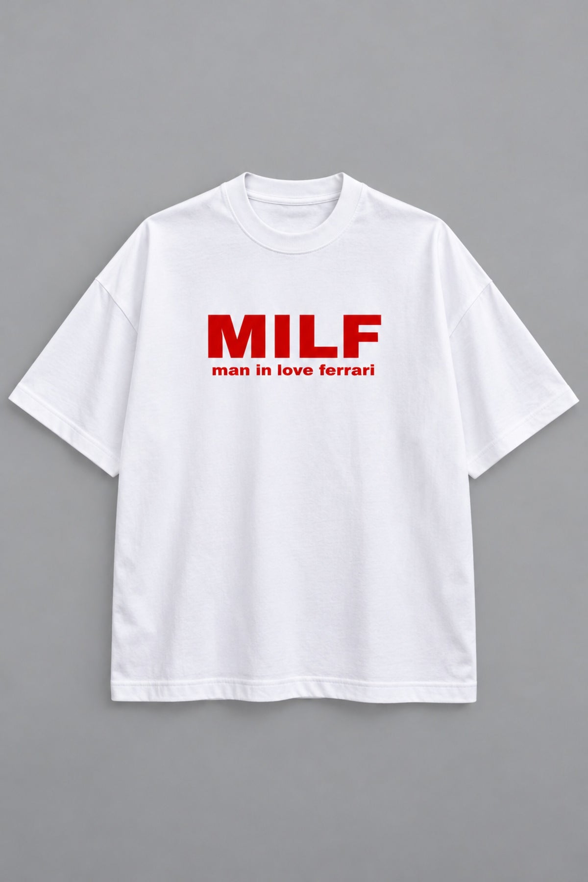 White oversized tshirt with Need Money for Ferrari bold drip graffiti text on back in black and red, drop shoulder boxy fit, men India