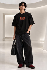 Black Nyay Darshan Sanskrit oversized tshirt with orange terracotta 6-panel art and Sanskrit logic philosophy text on back