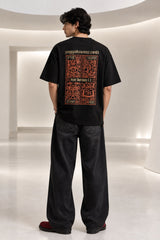 Black Nyay Darshan Sanskrit oversized tshirt with orange terracotta 6-panel art and Sanskrit logic philosophy text on back