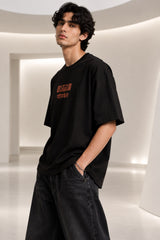 Black Nyay Darshan Sanskrit oversized tshirt with orange terracotta 6-panel art and Sanskrit logic philosophy text on back