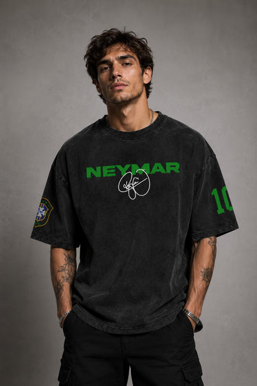 Model wearing an oversized black Neymar Legacy t-shirt with green 'Neymar' graphic and Brazilian CBF crest on sleeve.