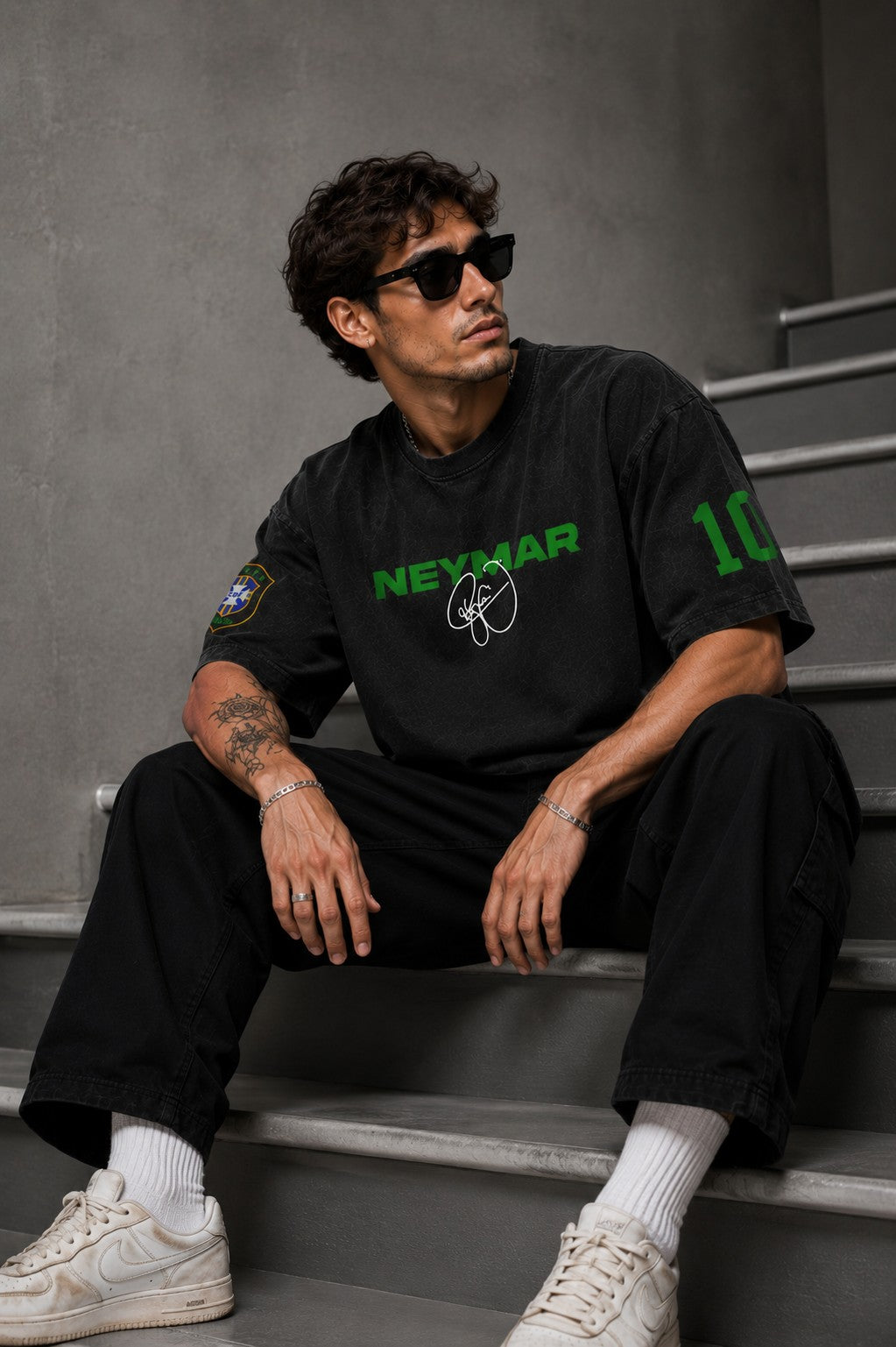 Model wearing an oversized black Neymar Legacy t-shirt with green 'Neymar' graphic and Brazilian CBF crest on sleeve.