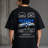 Black oversized t-shirt featuring a detailed white blueprint and a silver Nissan Skyline R34 with blue racing stripes graphic. Includes text 'The Nissan Skyline GTR'.