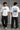 Black oversized t-shirt featuring a detailed white blueprint and a silver Nissan Skyline R34 with blue racing stripes graphic. Includes text 'The Nissan Skyline GTR'. - white