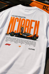 Model wearing white POPCASE Oscar Piastri McLaren oversized t shirt with orange McLaren speed mark logo and McLaren race car back graphic