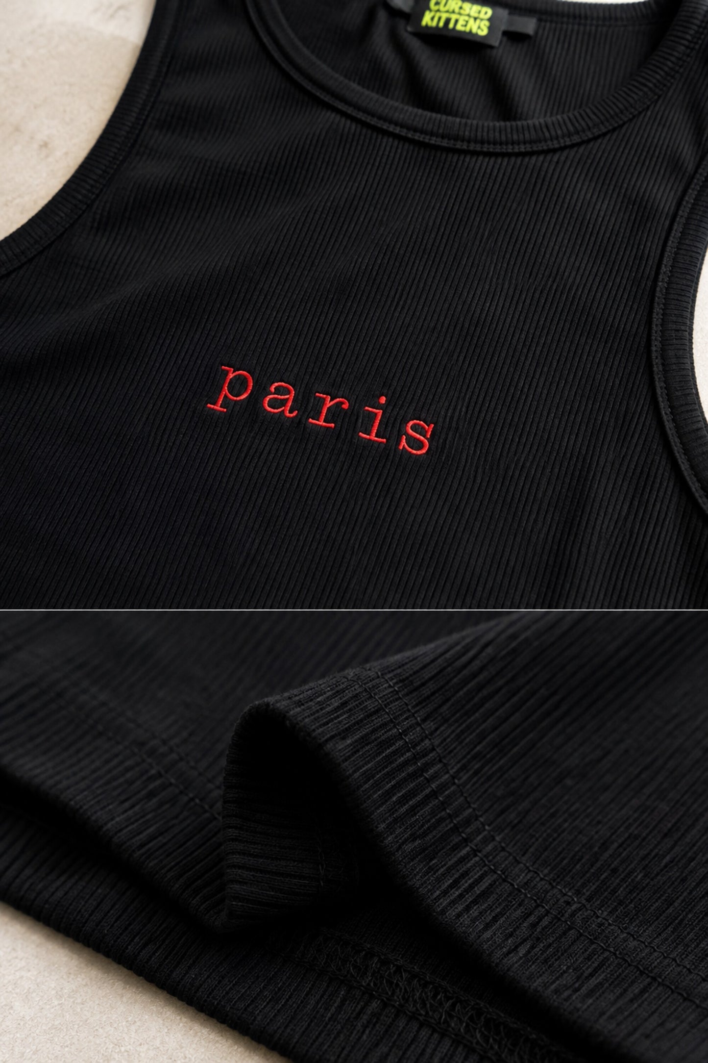 Black ribbed crop tank top with red lowercase paris lettering centered on chest
