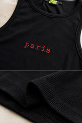 Black ribbed crop tank top with red lowercase paris lettering centered on chest