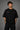 Black POPCASE oversized tshirt with Bad Intentions Only pink gothic text and tribal sun print on back, worn with black cargo pants