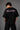 Black POPCASE oversized tshirt with Bad Intentions Only pink gothic text and tribal sun print on back, worn with black cargo pants