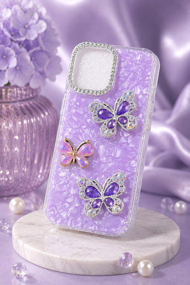 Purple phone case with butterfly designs on a marble stand with a soft purple background