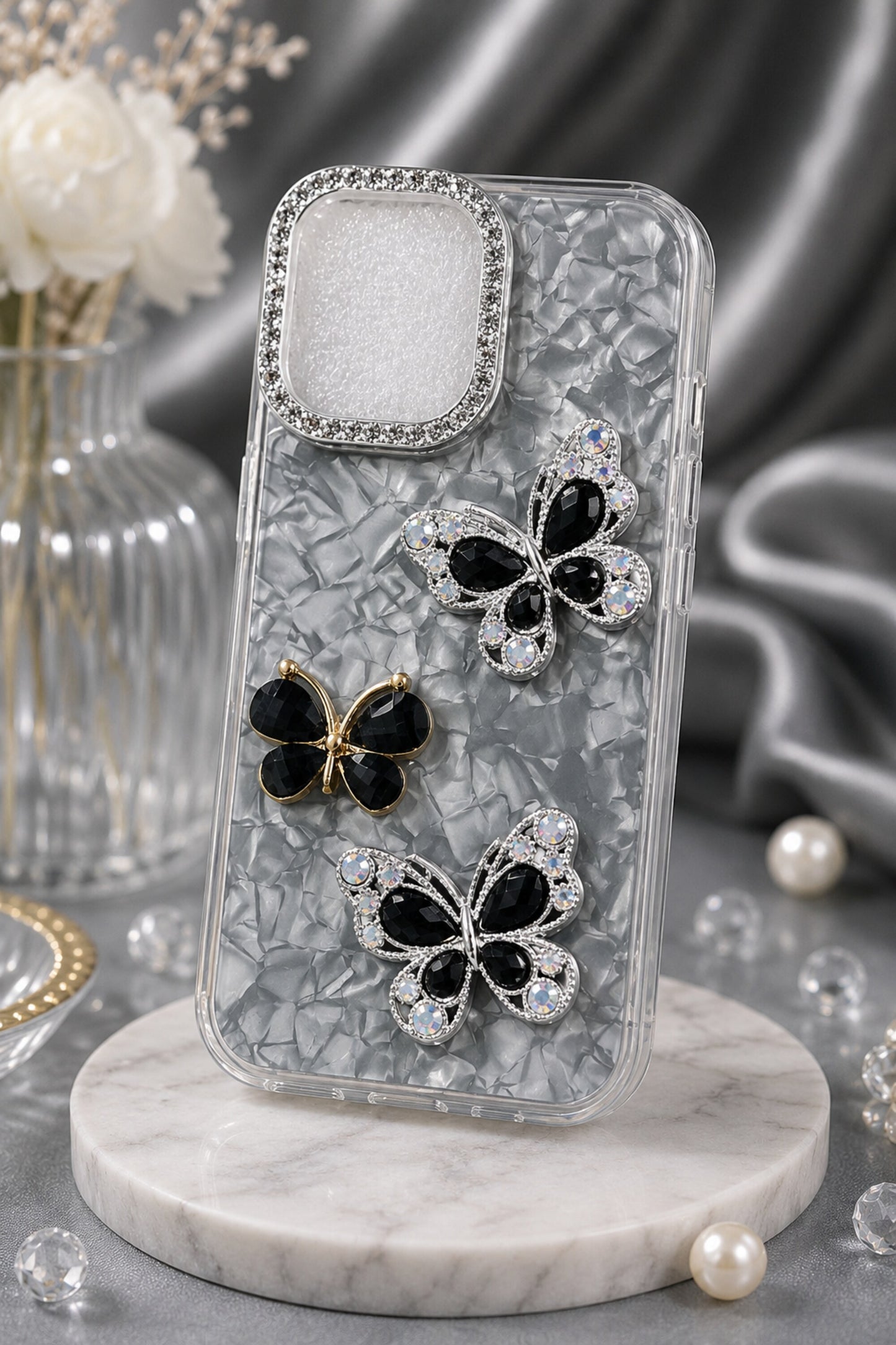 Phone case with butterfly designs on a marble stand
