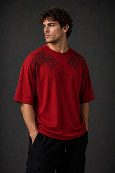 Red Nordic Heritage oversized t-shirt with black Viking-inspired graphic print on the front and back. Close-up shows DTF print quality and fabric texture.