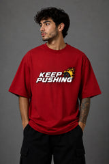 Red POPCASE oversized tshirt with Keep Pushing flaming F1 tire on front and Formula One is my love language vintage McLaren race car graphic on back