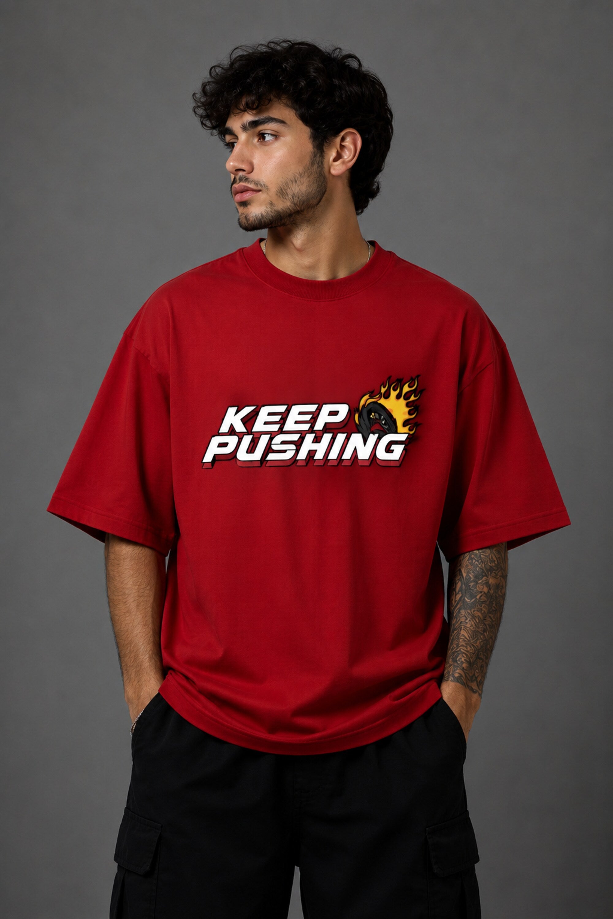 Red POPCASE oversized tshirt with Keep Pushing flaming F1 tire on front and Formula One is my love language vintage McLaren race car graphic on back