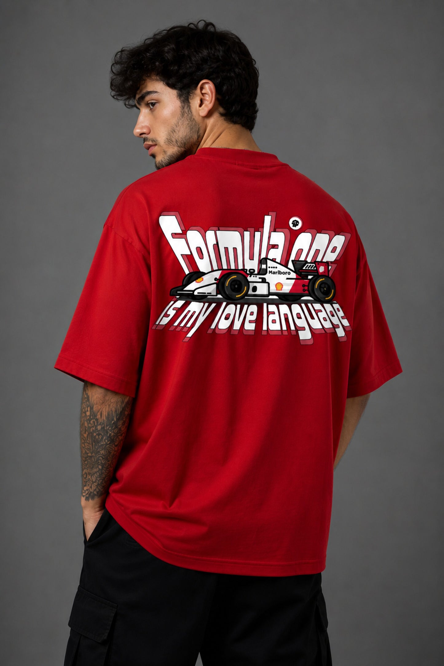 Red POPCASE oversized tshirt with Keep Pushing flaming F1 tire on front and Formula One is my love language vintage McLaren race car graphic on back