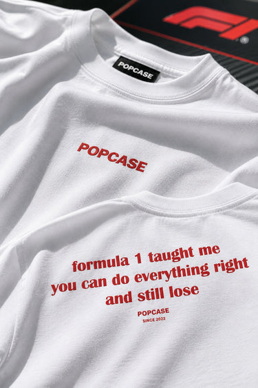 White sweatshirt with red text and 'POPCASE' branding on a black background with 'F1' logo.