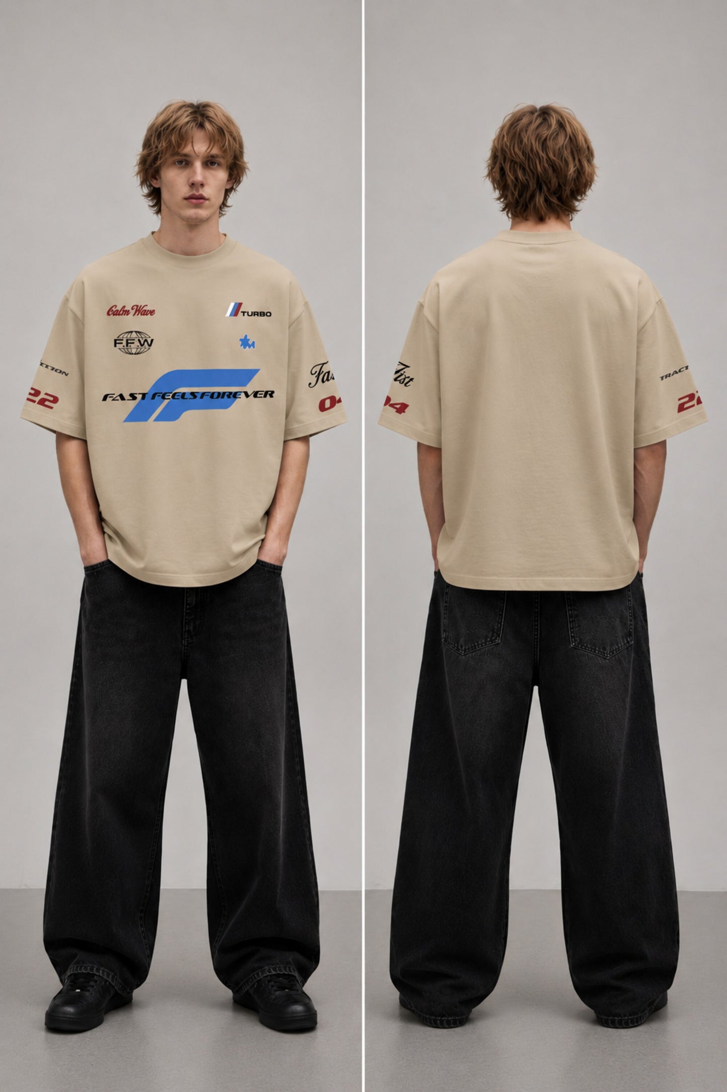 Model wearing a black Fast Feels Forever oversized t-shirt with graphic prints, sitting on a leather couch. - beige