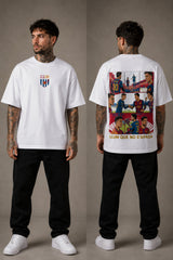 Man wearing a red FCB Messi fan oversized t-shirt, black pants, and white sneakers, sitting on a brown couch. - white