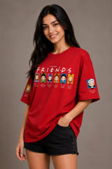Woman wearing a red 'Friends' themed t-shirt with character illustrations on a plain background