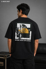 Man wearing FROM THE NORTH oversized t-shirt in beige with black cargo pants and white sneakers. Features The North Face logo and graphic on front and back.